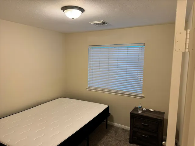 a bathroom with a shower and a mirror