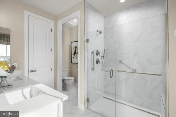a bathroom with a bathtub and a sink