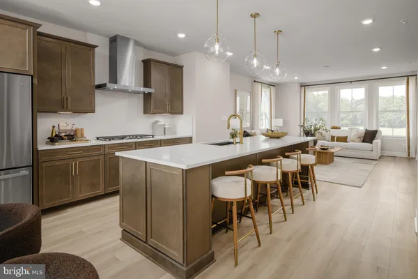 a kitchen with sink cabinets and wooden floor