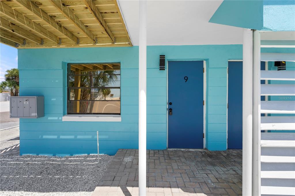 13343 Gulf Boulevard, Unit C9 Madeira Beach, FL 33708 - Photo 13 of 17 a view of a front door of the house