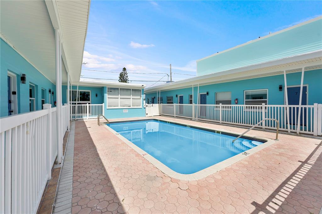 13343 Gulf Boulevard, Unit C9 Madeira Beach, FL 33708 - Photo 8 of 17 swimming pool view with a outdoor space