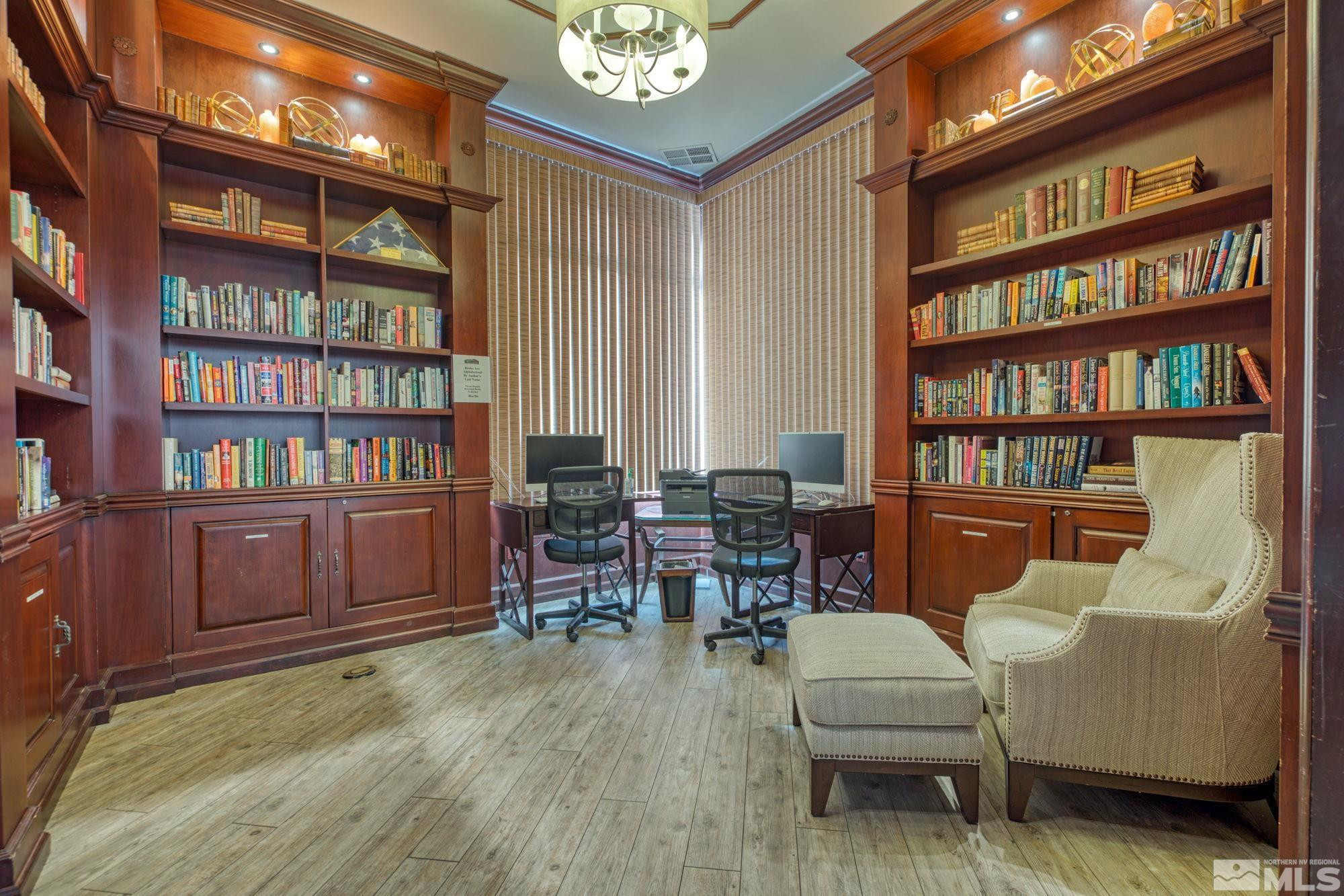 900 South Meadows Parkway, Unit 3423 Reno, NV 89521 - Photo 30 of 37 a living room with furniture and a book shelf