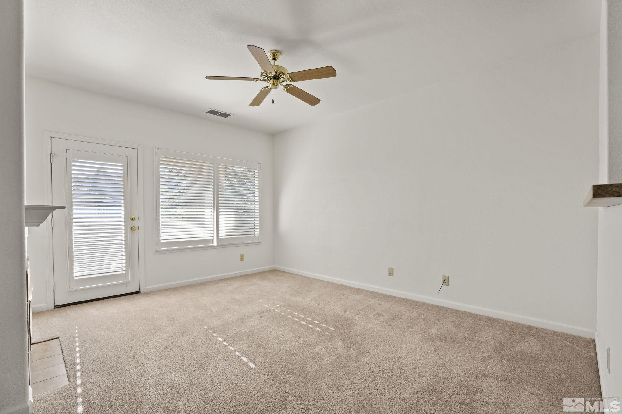 900 South Meadows Parkway, Unit 3423 Reno, NV 89521 - Photo 4 of 37 an empty room with windows and fan