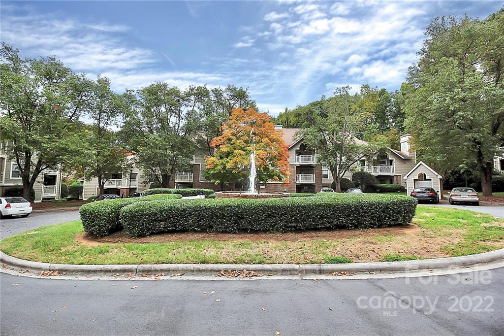 5003 Sharon Road, Unit N Charlotte, NC 28210 - Photo 2 of 11 a view of a house with a yard