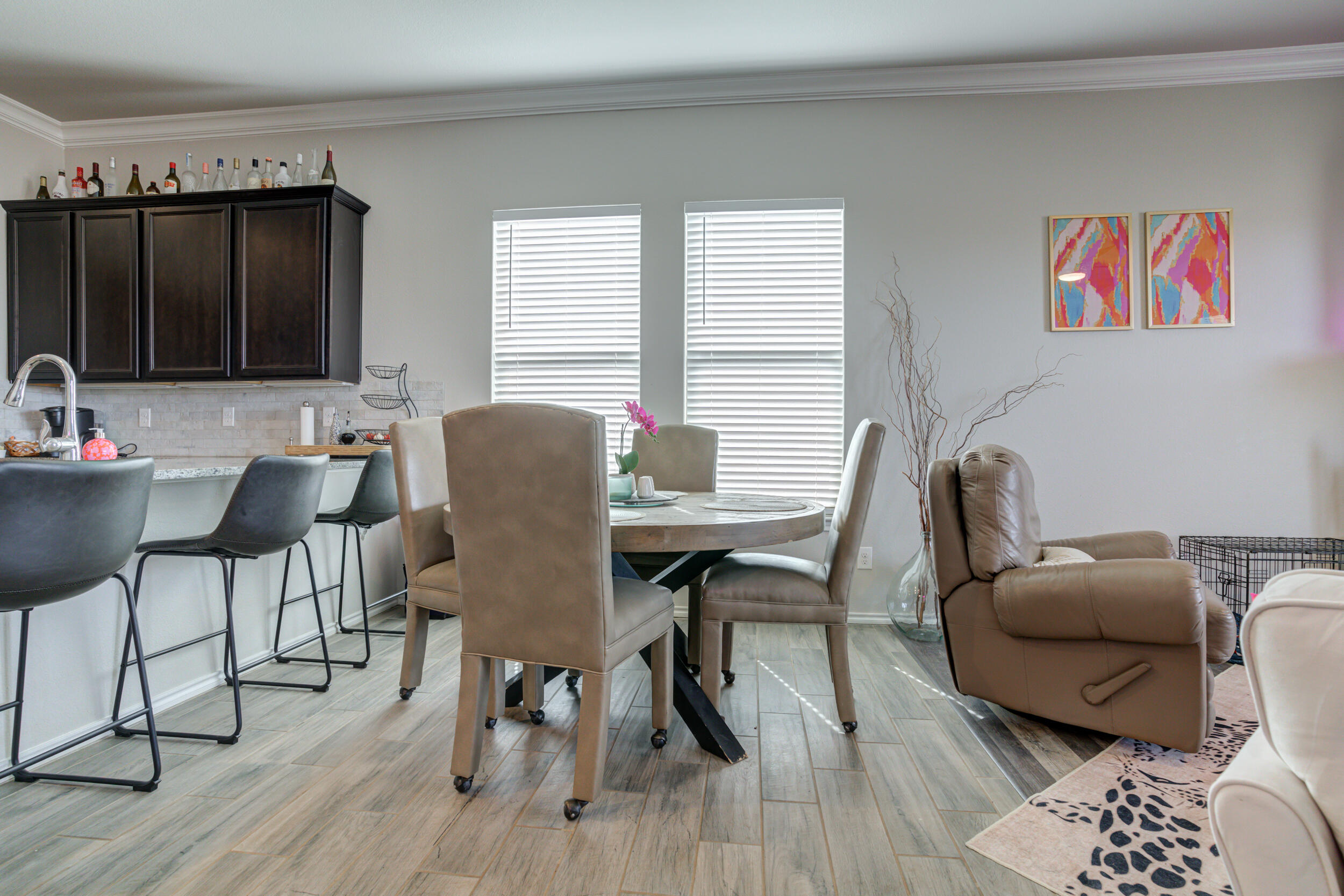 6818 40th Street Lubbock, TX 79407 - Photo 12 of 43 a work room with furniture and a wooden floor