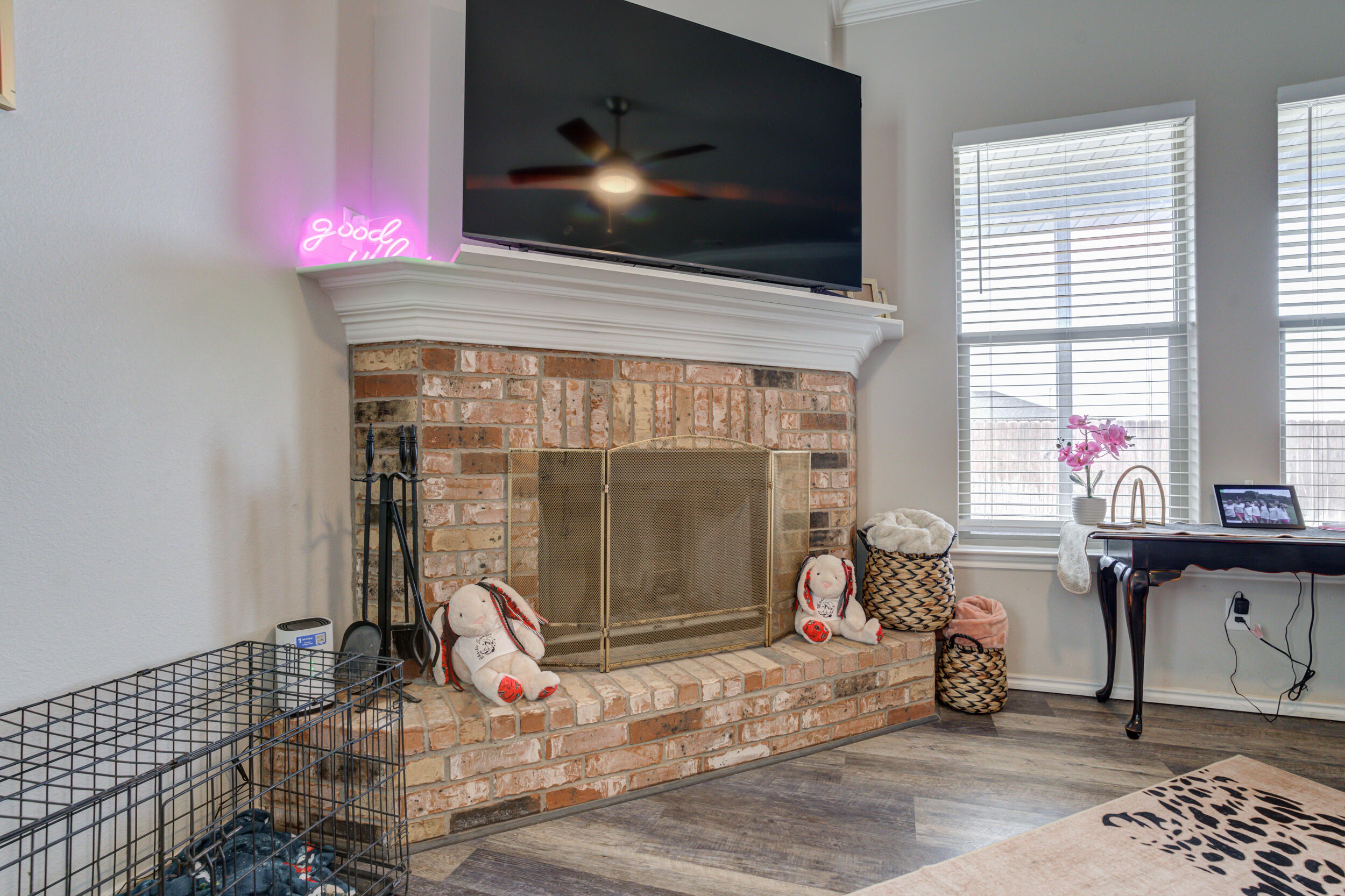 6818 40th Street Lubbock, TX 79407 - Photo 19 of 43 a living room with furniture and a flat screen tv