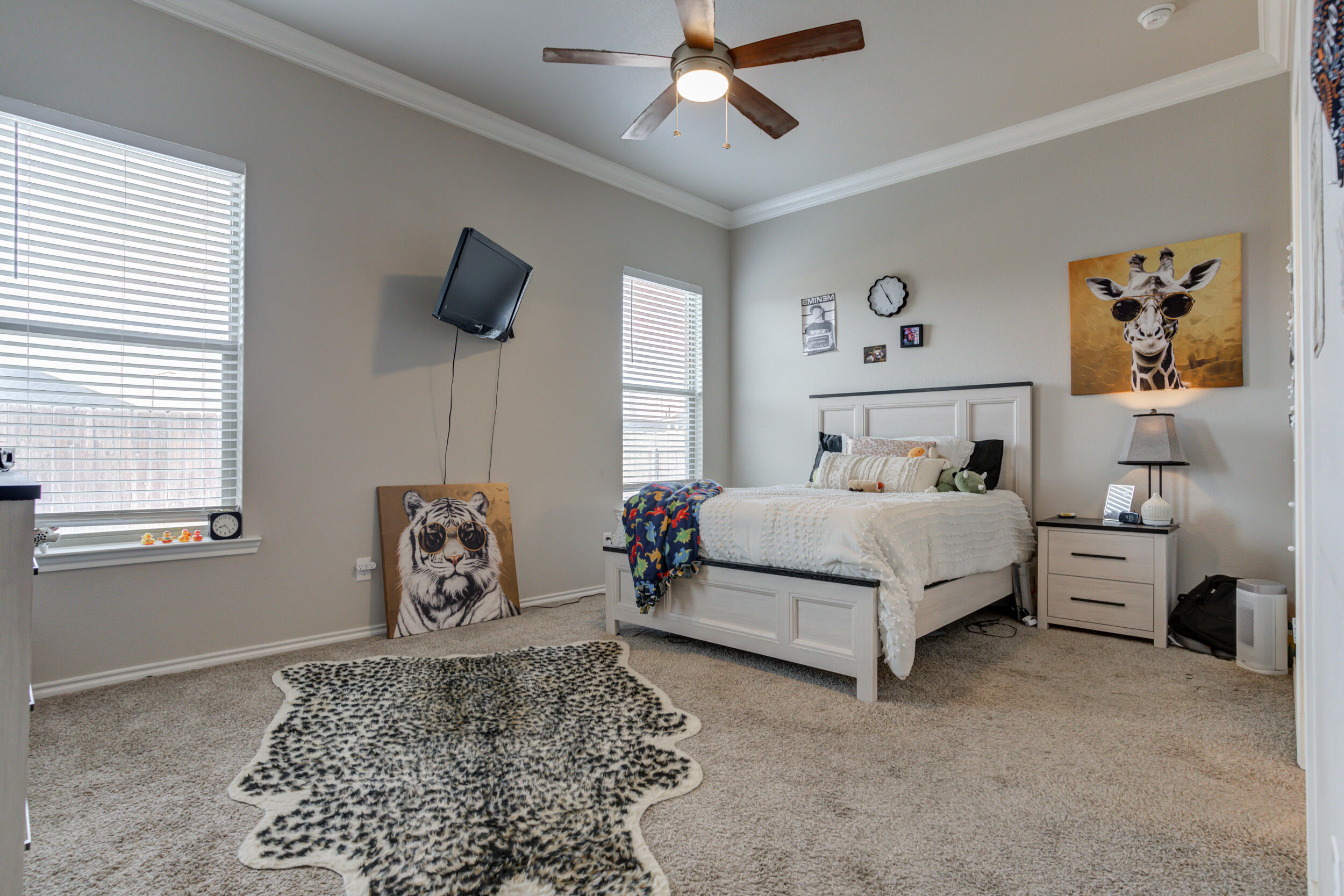 6818 40th Street Lubbock, TX 79407 - Photo 20 of 43 a bedroom with a bed dresser and window