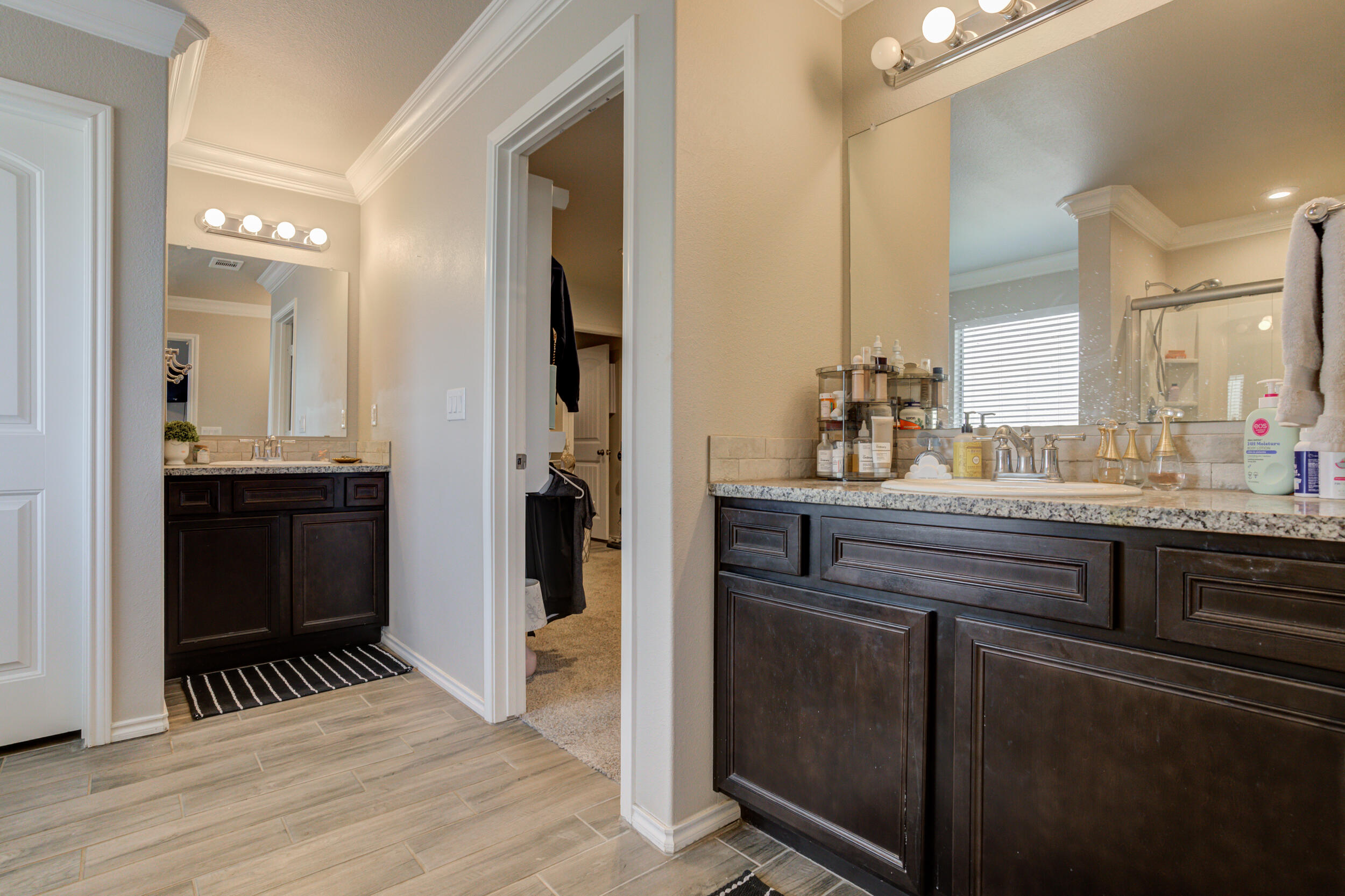 6818 40th Street Lubbock, TX 79407 - Photo 24 of 43 a bathroom with a sink and a mirror