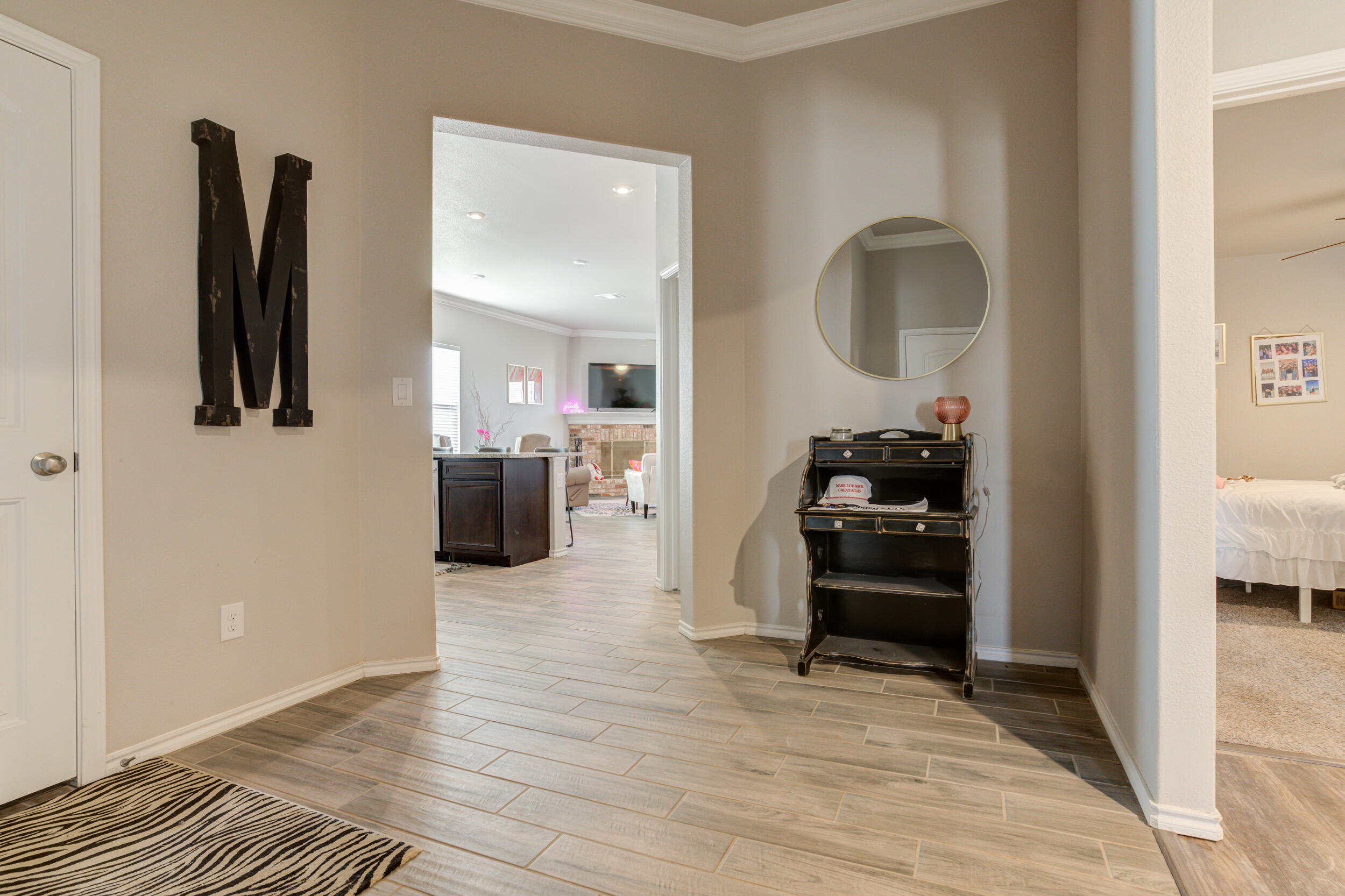 6818 40th Street Lubbock, TX 79407 - Photo 3 of 43 a living room with furniture and a mirror