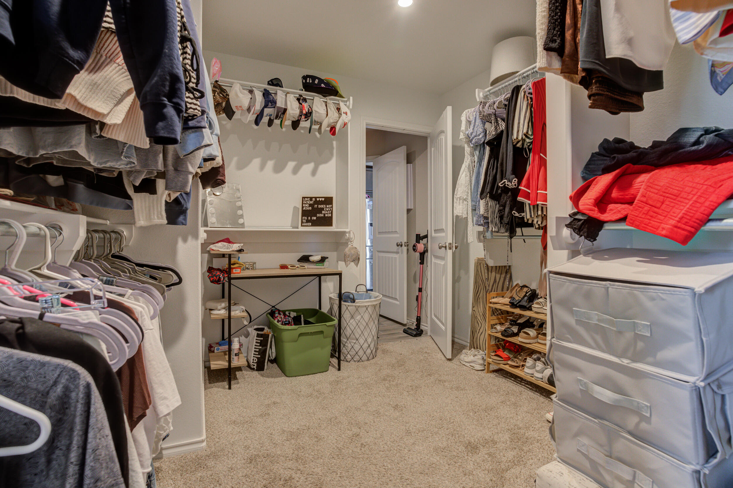 6818 40th Street Lubbock, TX 79407 - Photo 31 of 43 a view of walk in closet with clothes and shoes