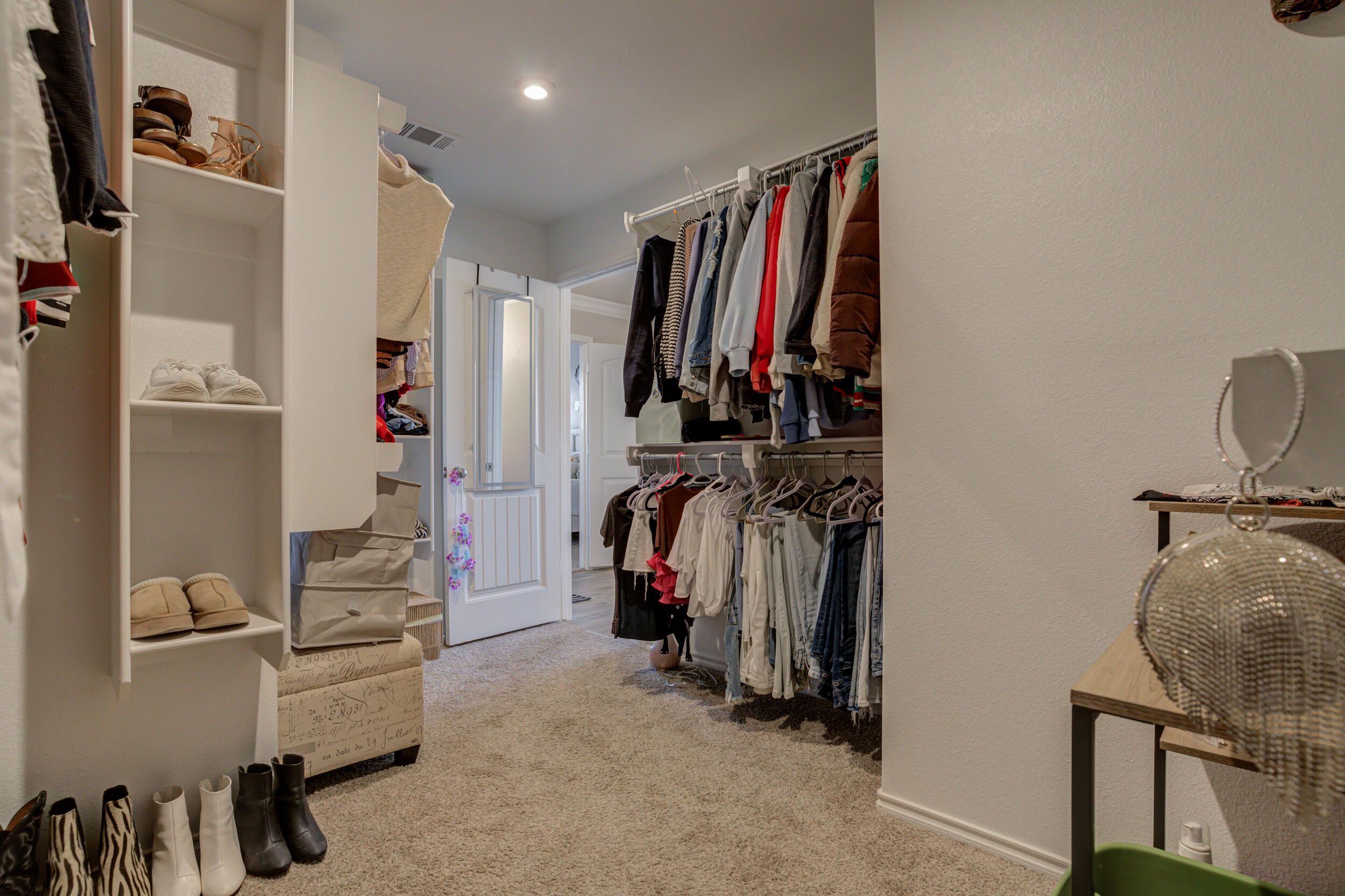 6818 40th Street Lubbock, TX 79407 - Photo 32 of 43 a view of walk in closet with clothes and shoes