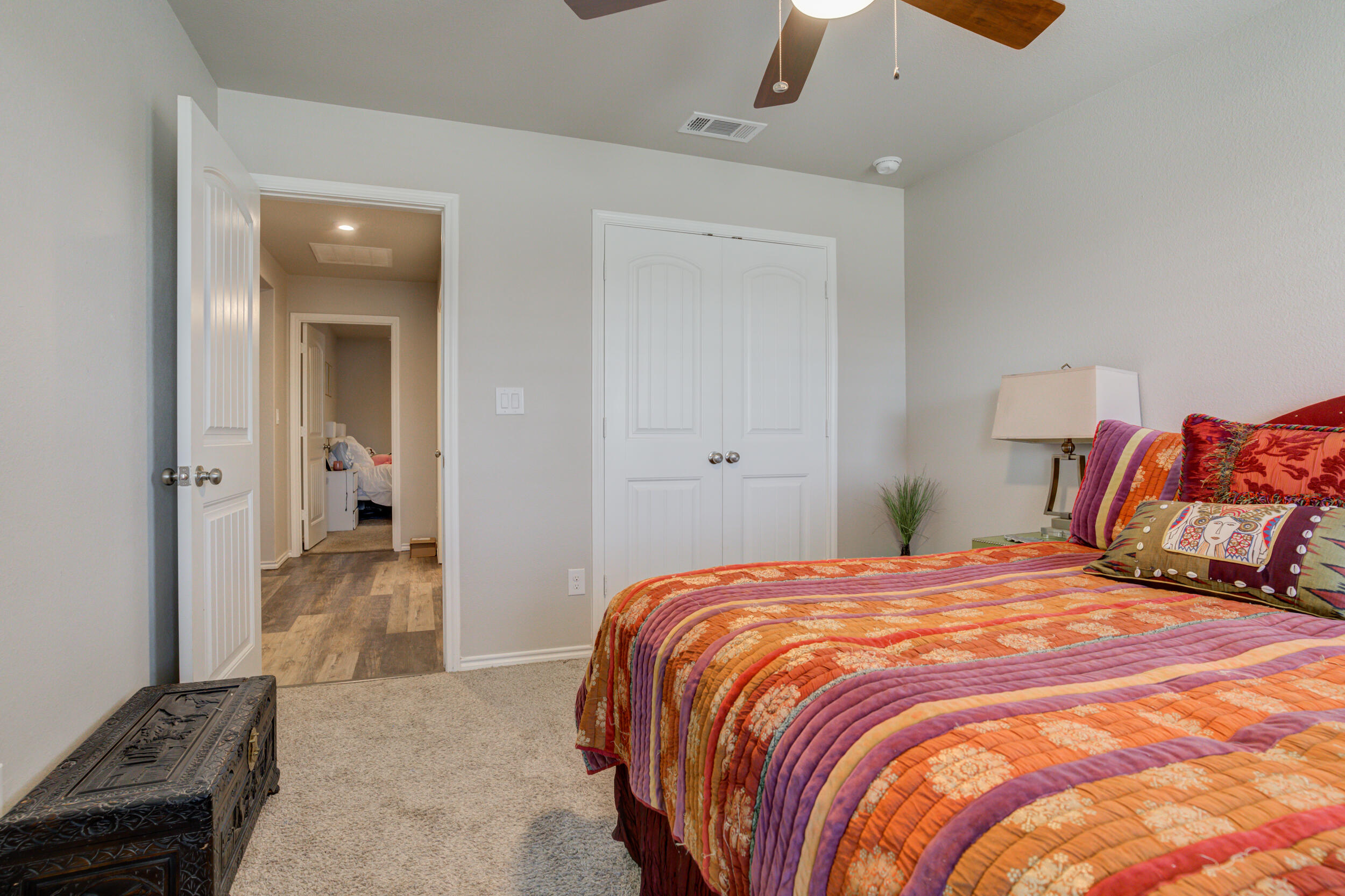 6818 40th Street Lubbock, TX 79407 - Photo 38 of 43 a bedroom with a bed and dresser