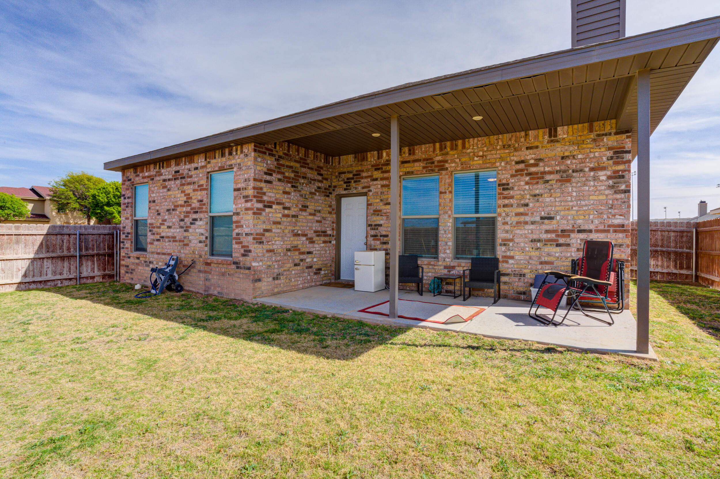 6818 40th Street Lubbock, TX 79407 - Photo 39 of 43 a view of a chairs and table in the patio