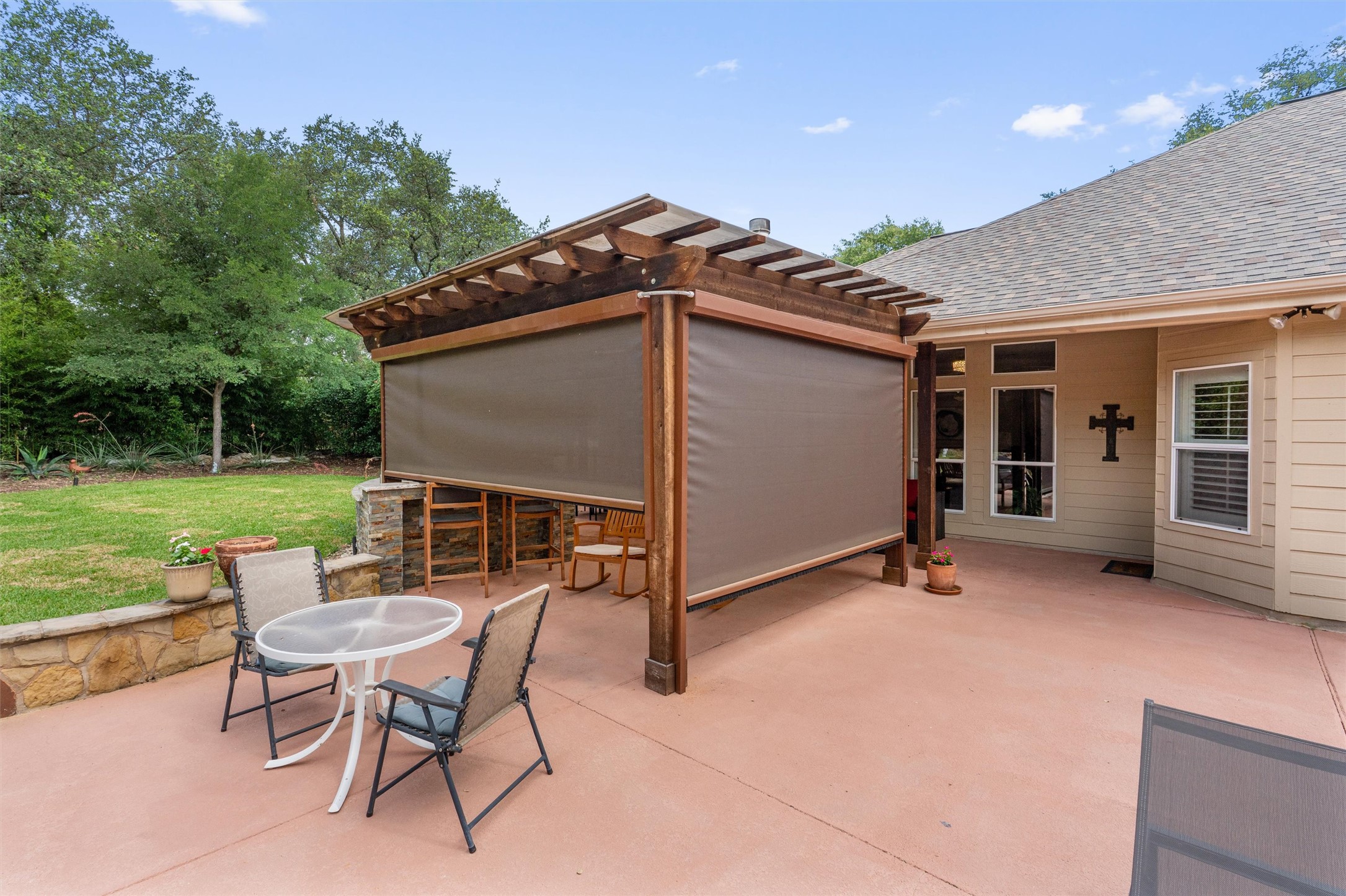 223 East Ridgewood Road Georgetown, TX 78633 - Photo 29 of 40 An inviting outdoor living space features a stylish pergola with shades