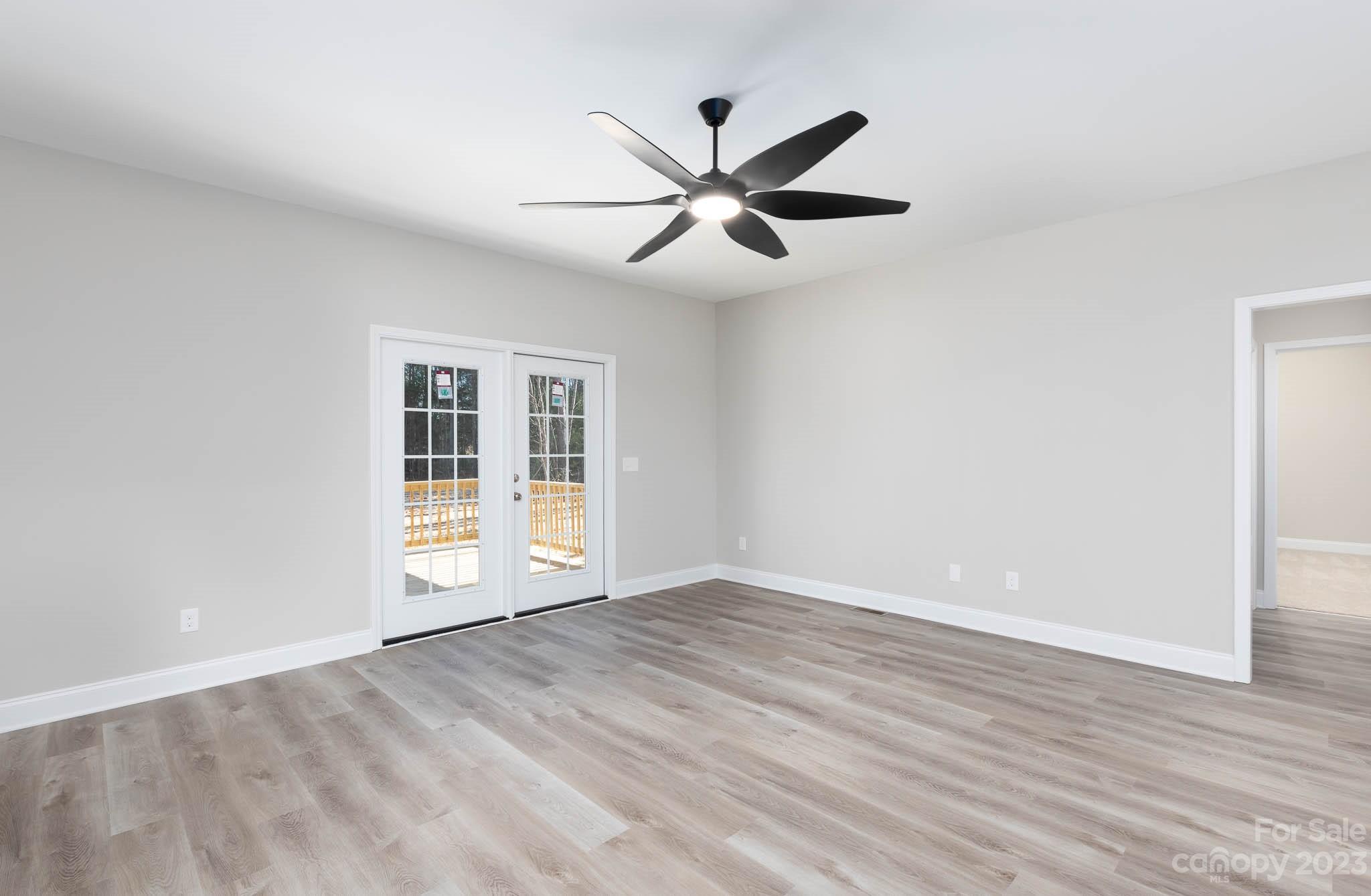 4434 Culp Road Edgemoor, SC 29712 - Photo 11 of 36 wooden floor in an empty room with a window