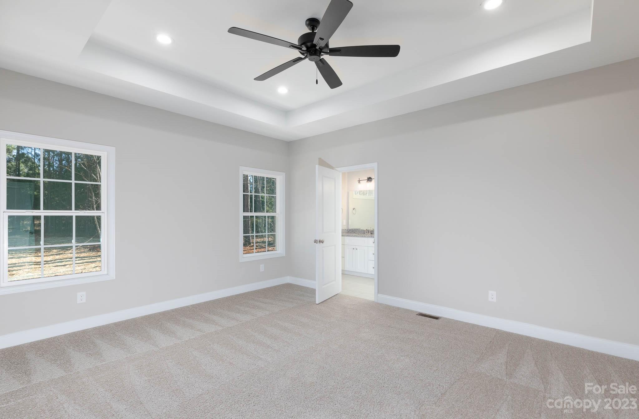 4434 Culp Road Edgemoor, SC 29712 - Photo 18 of 36 an empty room with windows and fan