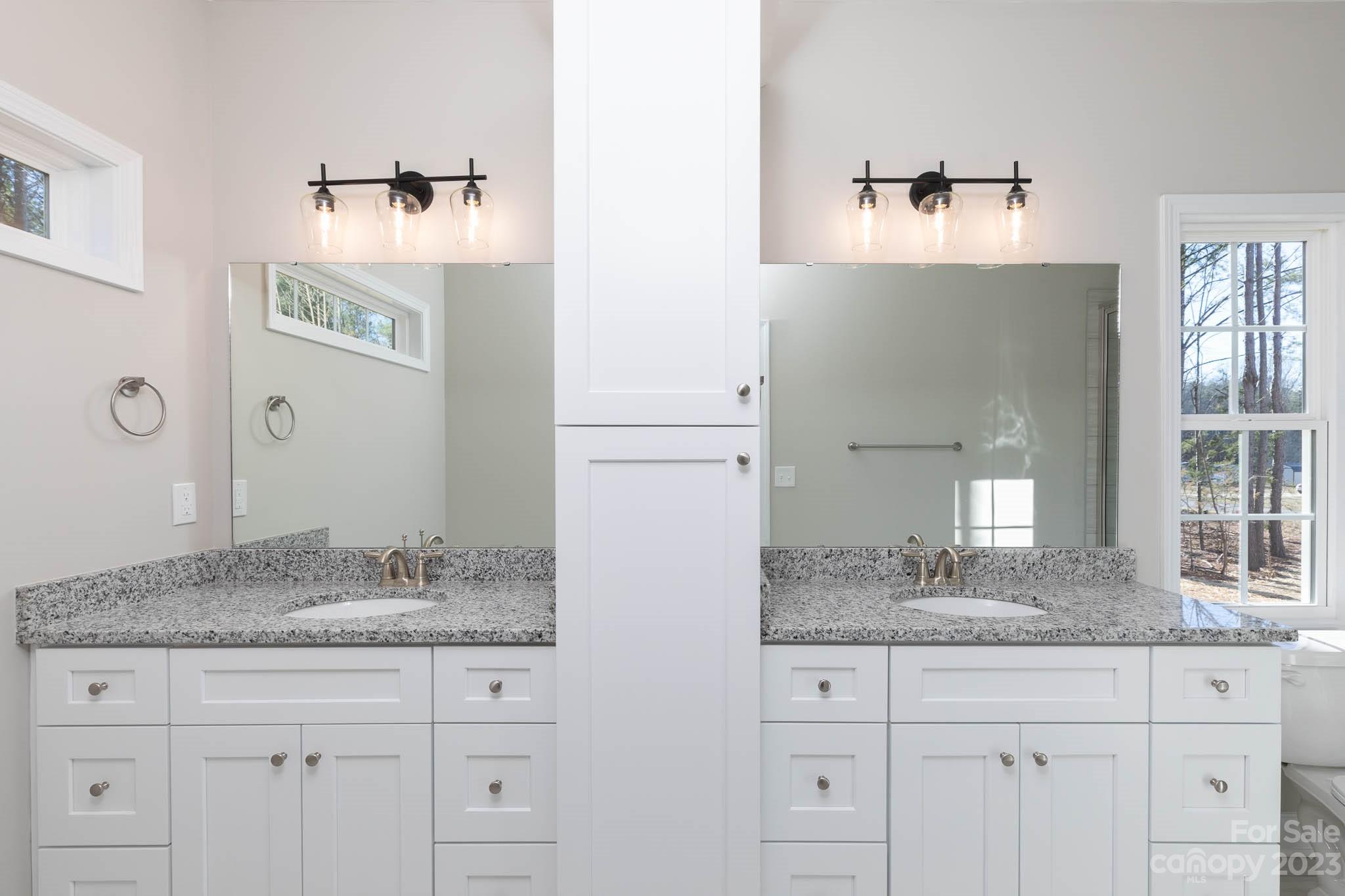 4434 Culp Road Edgemoor, SC 29712 - Photo 19 of 36 a bathroom with a granite countertop sink and a mirror