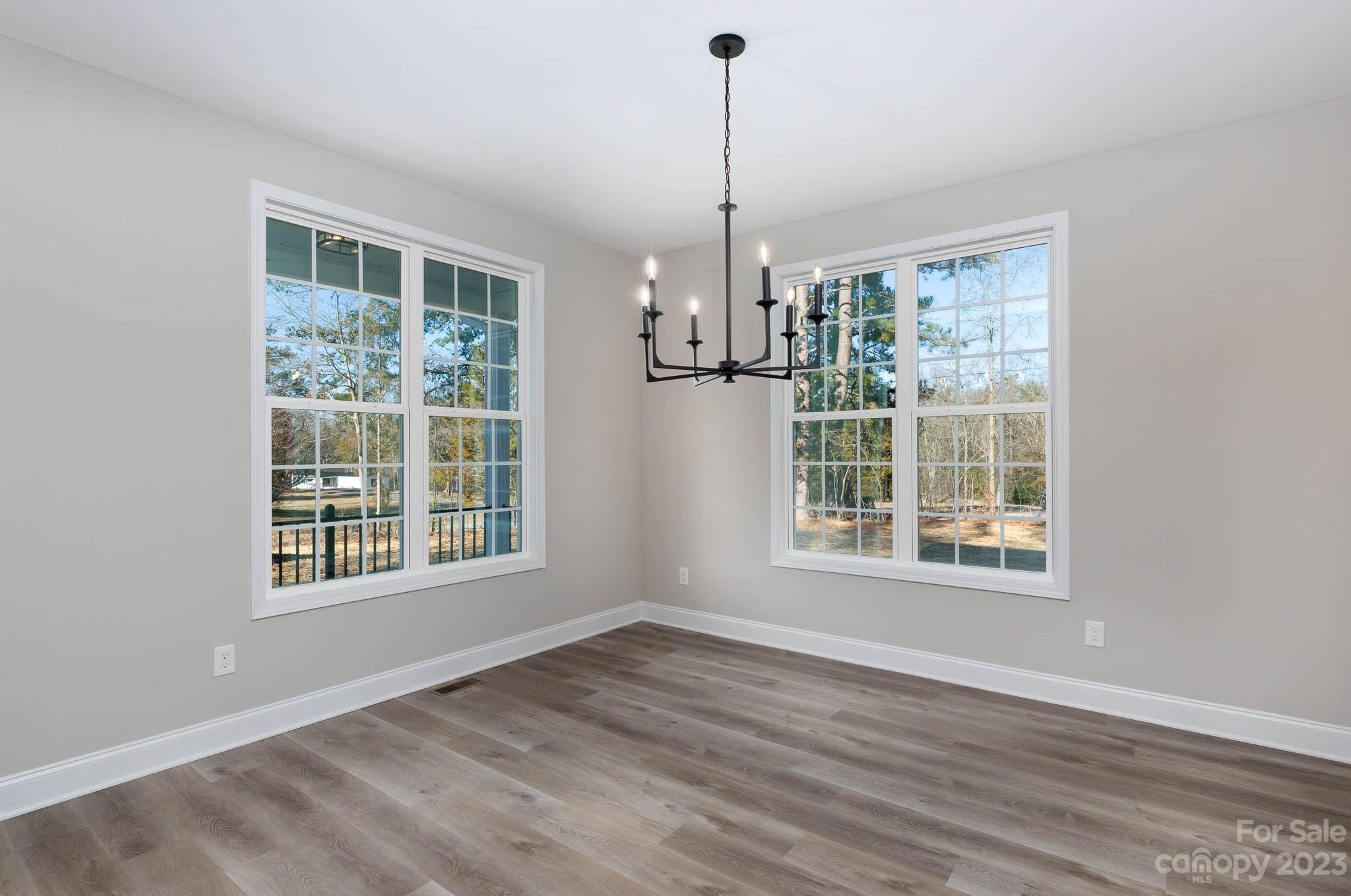 4434 Culp Road Edgemoor, SC 29712 - Photo 5 of 36 a view of an empty room with a window and wooden floor