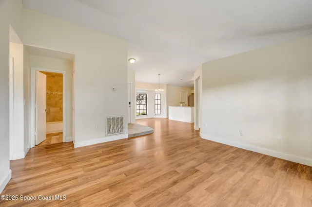 a view of a livingroom with wooden floor