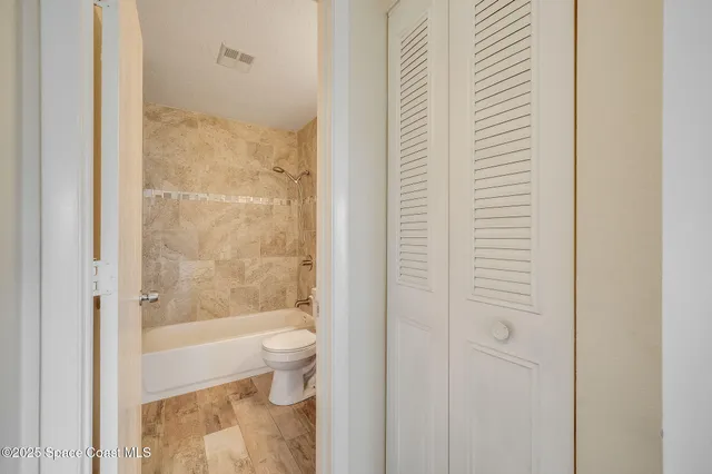 a bathroom with a bathtub and a toilet