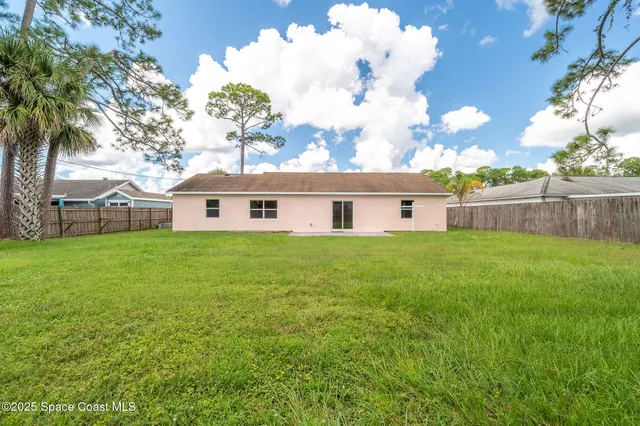 a backyard of a house with lots of green space
