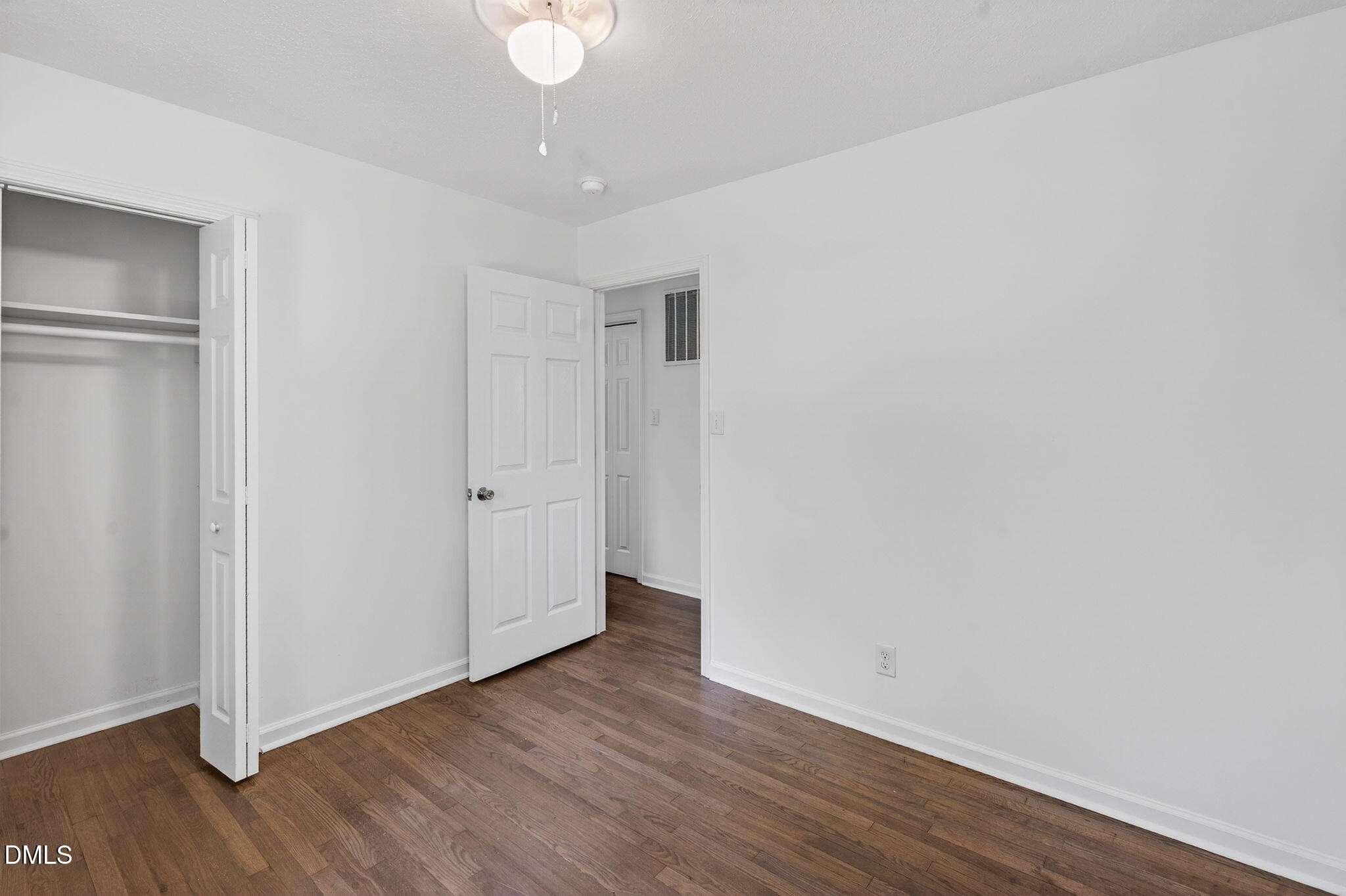 904 Seabrook Road Raleigh, NC 27610 - Photo 13 of 31 a view of an empty room with wooden floor