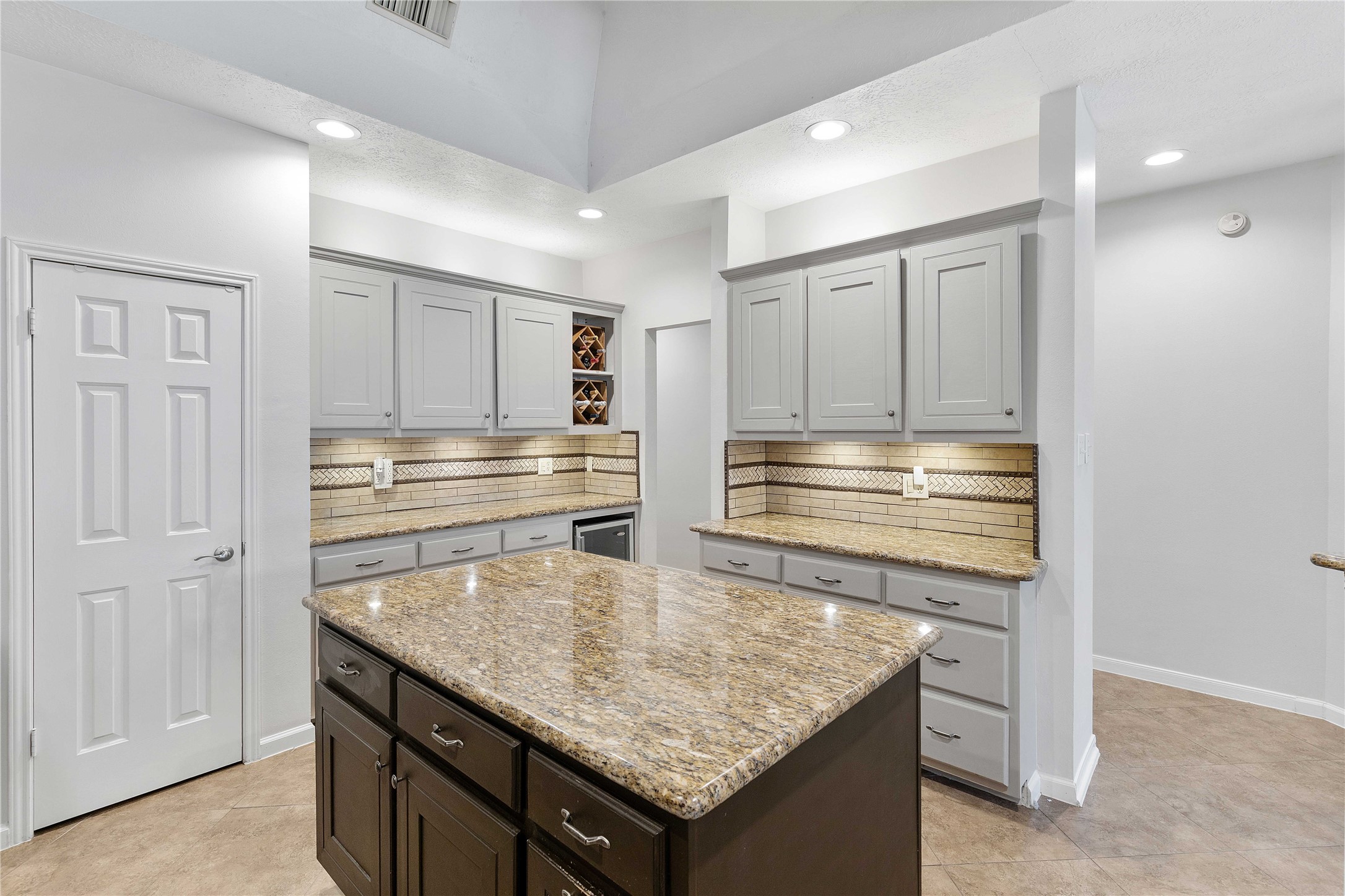 1707 Moston Drive Spring, TX 77386 - Photo 13 of 41 a kitchen with granite countertop stainless steel appliances and white cabinets