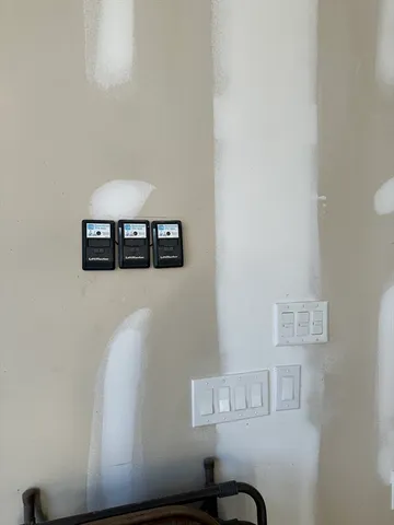 a room with furniture and wall paintings