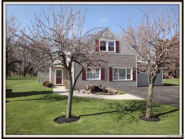 580 Rowley Road Cheektowaga, NY 14043 - Photo 1 of 1 Exterior Front. Parklike front yard with stone pon
