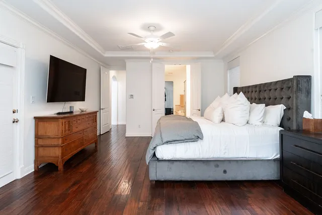 a living room with furniture and flat screen tv