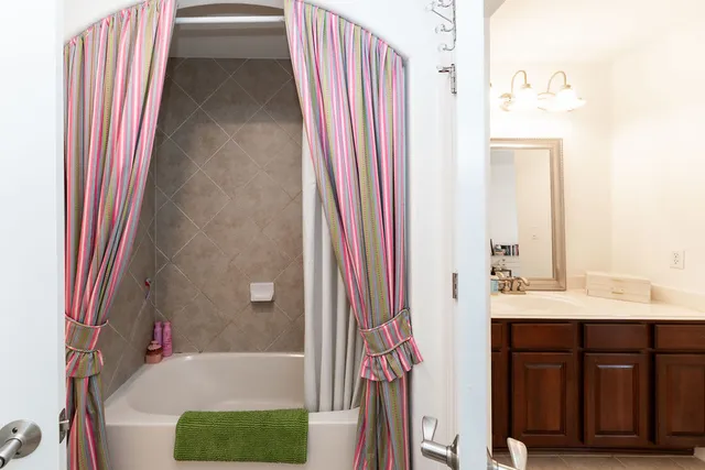 a bathroom with a bathtub and a sink