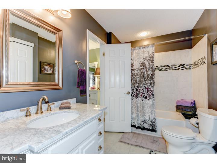 306 Paddock Drive Chesterbrook, PA 19087 - Photo 13 of 16 a bathroom with a granite countertop sink a toilet and shower