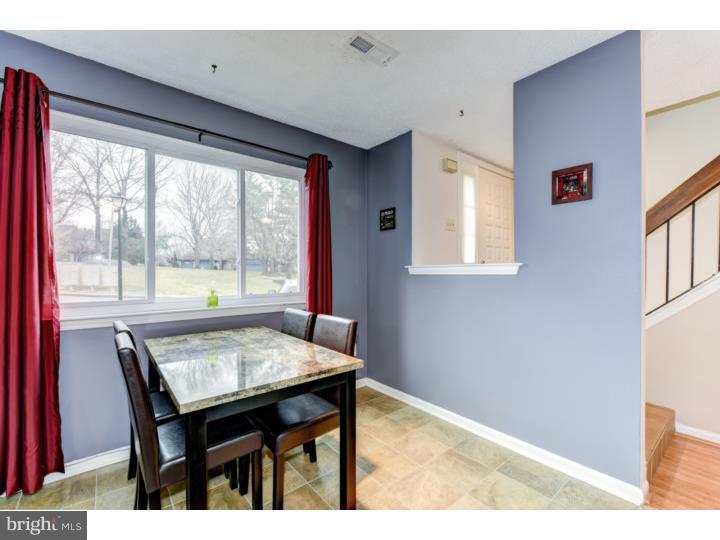 306 Paddock Drive Chesterbrook, PA 19087 - Photo 6 of 16 a view of a dining room with furniture and a window