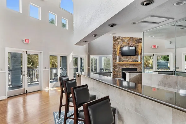 a living room with fireplace furniture and a flat screen tv
