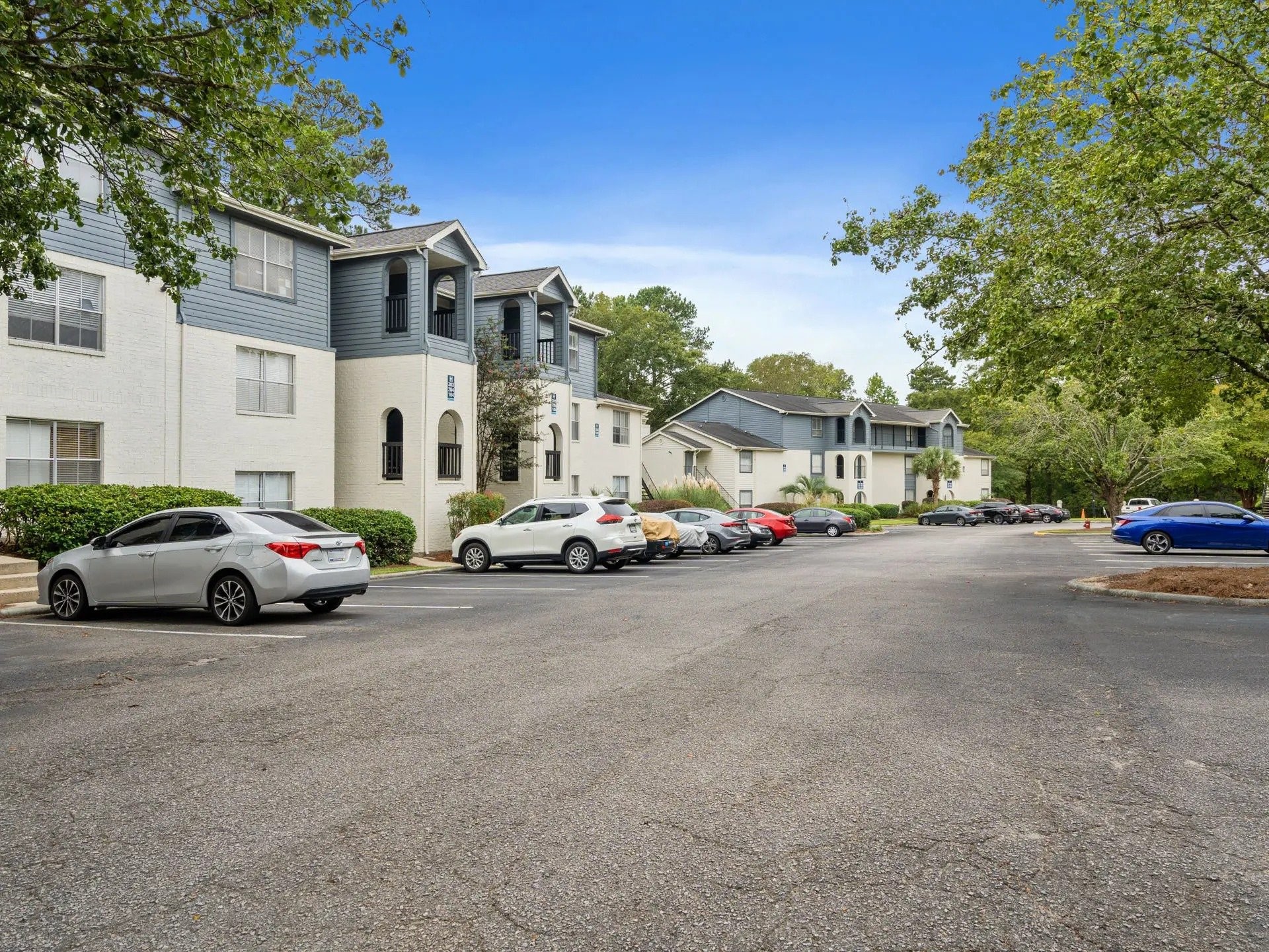 501 Pelham Drive Columbia, SC 29209 - Photo 2 of 23 a view of road with card parked on side and retail shops