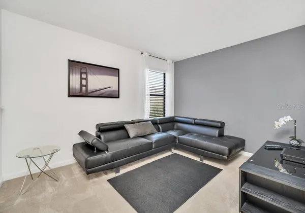 a living room with furniture and a couch