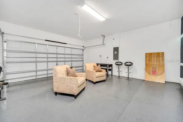 a bedroom with furniture and a flat screen tv