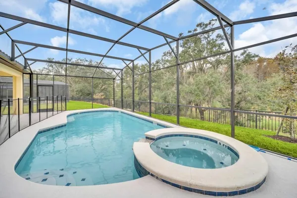 a view of a swimming pool with a porch