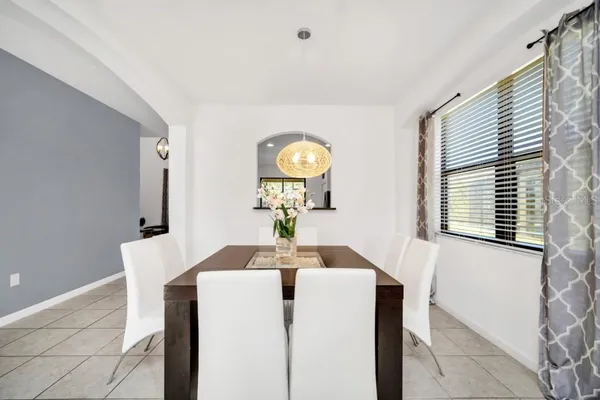 a dining room with furniture and window