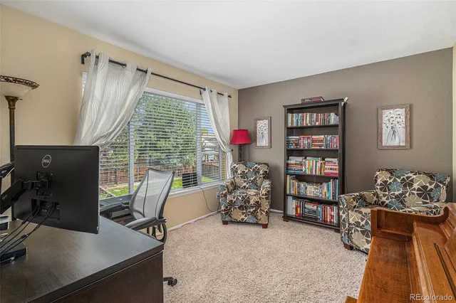 a workspace with furniture and a window