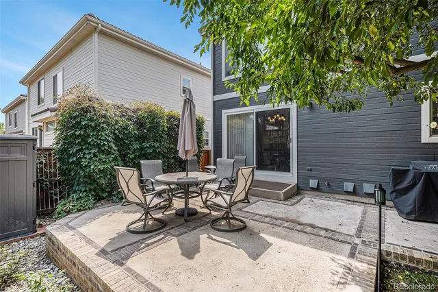 a view of a patio with couple of chairs
