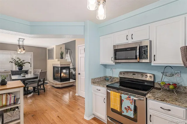 a kitchen with a stove and a microwave