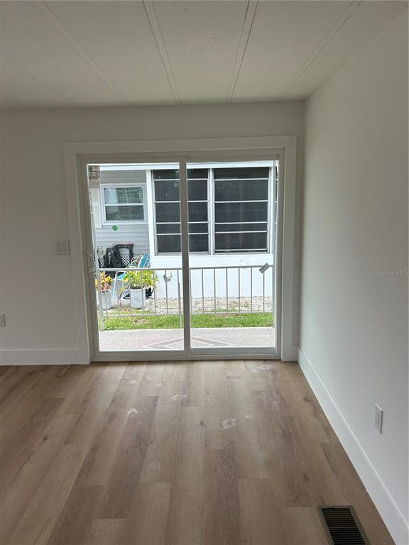 4443 Tucker Square New Port Richey, FL 34652 - Photo 13 of 24 a view of an empty room with a window