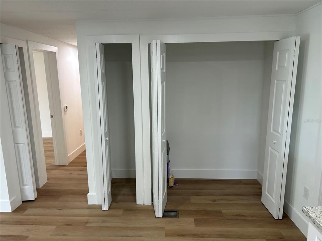 4443 Tucker Square New Port Richey, FL 34652 - Photo 15 of 24 a view of a hallway with wooden floor