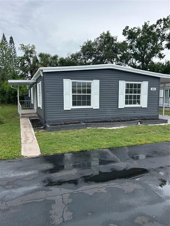 4443 Tucker Square New Port Richey, FL 34652 - Photo 2 of 24 a view of outdoor space yard and front view of a house