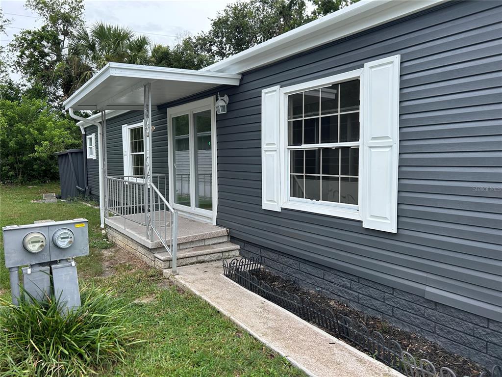 4443 Tucker Square New Port Richey, FL 34652 - Photo 3 of 24 a front view of a house with garden