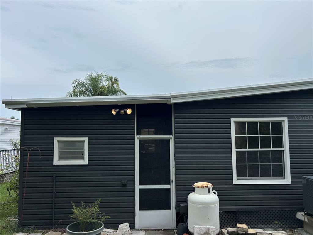 4443 Tucker Square New Port Richey, FL 34652 - Photo 6 of 24 a front view of a house with balcony