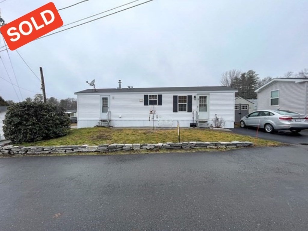 11 Groton School Road, Unit 8 Ayer, MA 01432 - Photo 1 of 14 a view of street with parked cars
