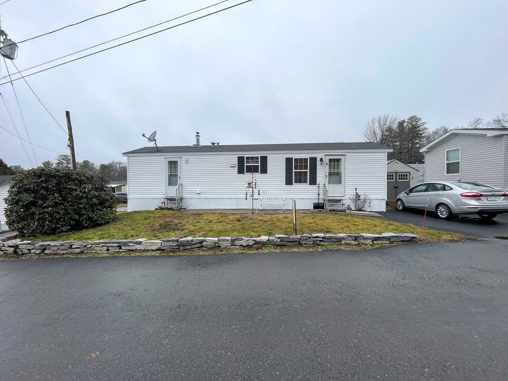 11 Groton School Road, Unit 8 Ayer, MA 01432 - Photo 3 of 14 a view of a house with a swimming pool