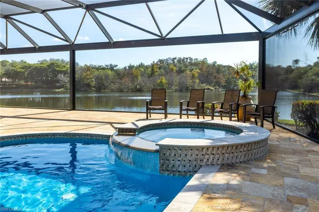 a dining room with furniture and a floor to ceiling window